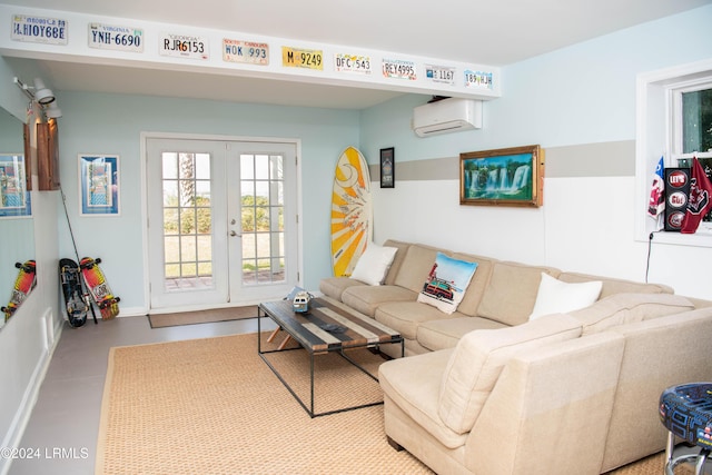 living room featuring a wall mounted air conditioner, concrete floors, and french doors