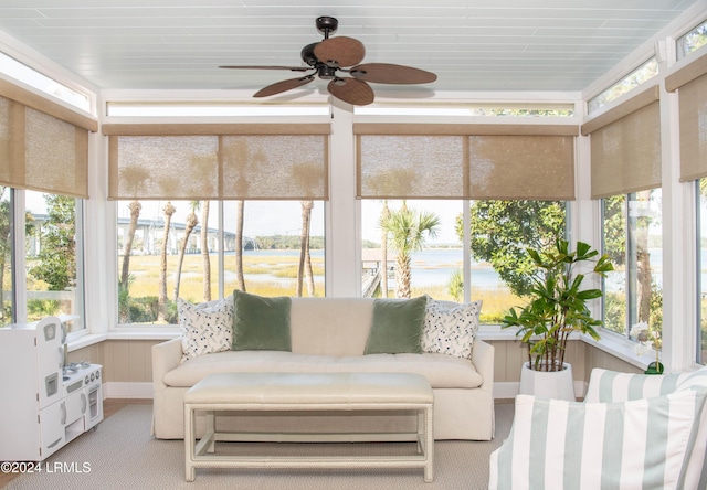 sunroom / solarium featuring ceiling fan