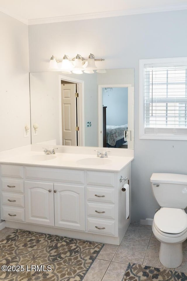 1003 9th St, Port Royal, SC 29935 - full bathroom with double vanity, crown molding, ensuite bath, and tile patterned flooring