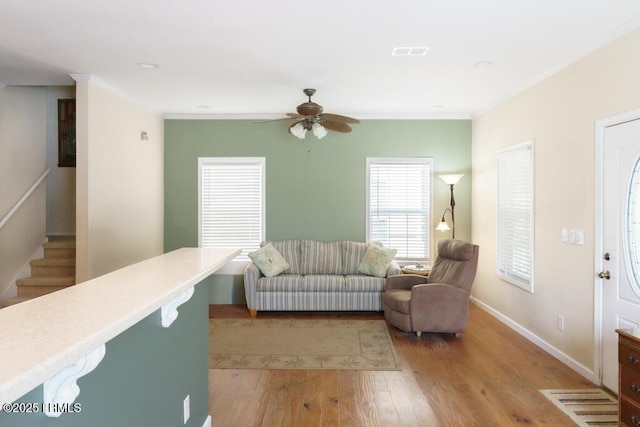 1003 9th St, Port Royal, SC 29935 - living area featuring light wood-type flooring, crown molding, ceiling fan, and recessed lighting