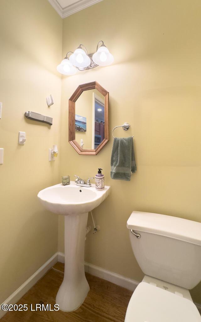 1003 9th St, Port Royal, SC 29935 - half bath with toilet and ornamental molding