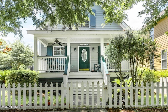 1003 9th St, Port Royal, SC 29935 - view of front facade featuring a porch, a fenced front yard, and a ceiling fan