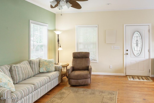 1003 9th St, Port Royal, SC 29935 - living area with a ceiling fan, crown molding, and light wood-type flooring