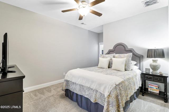 bedroom featuring light carpet, baseboards, visible vents, and ceiling fan