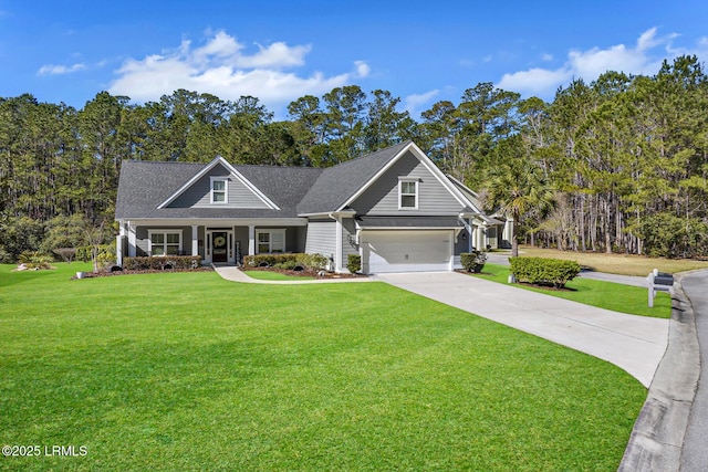 craftsman-style house with concrete driveway, a front lawn, and an attached garage