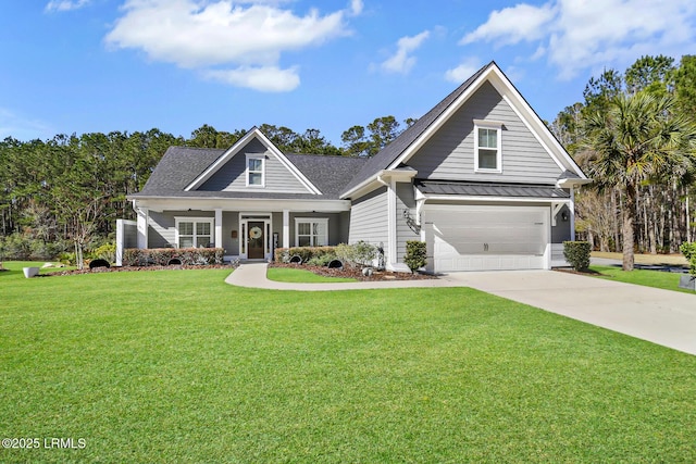 view of front of home featuring driveway, metal roof, a standing seam roof, covered porch, and a front yard