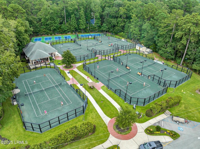 birds eye view of property with a view of trees