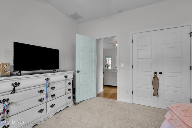 carpeted bedroom with a closet