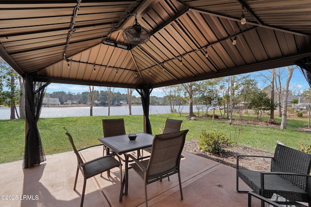 view of patio with a gazebo and a water view