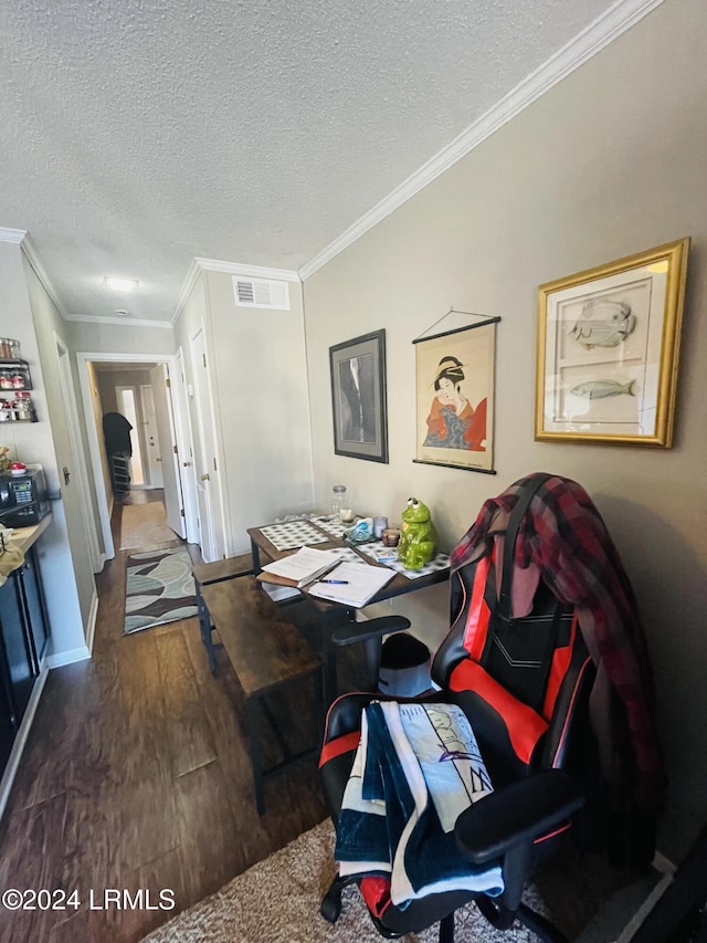 interior space with crown molding, dark hardwood / wood-style floors, and a textured ceiling