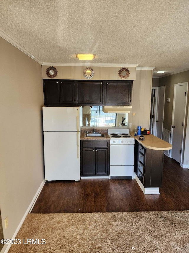 kitchen with sink, a textured ceiling, white appliances, and kitchen peninsula