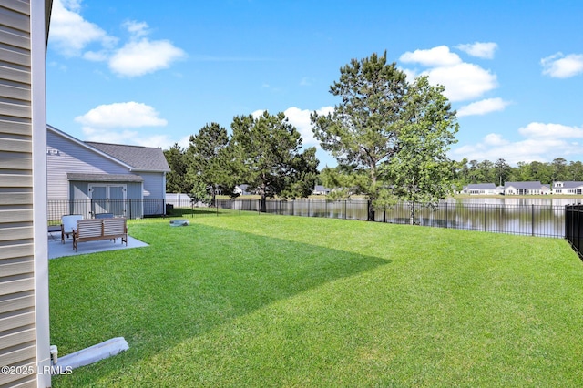 1216 Hearthstone Dr, Ridgeland, SC 29936 - view of yard with a water view, a patio area, and a fenced backyard