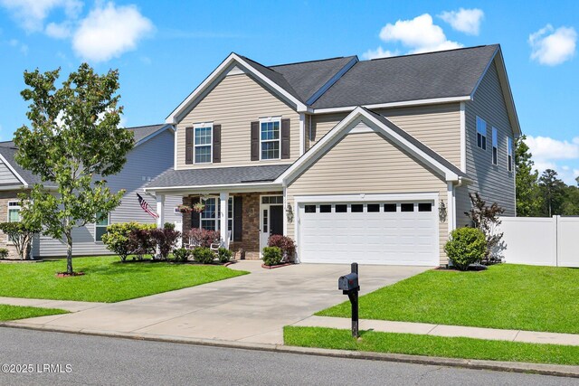 1216 Hearthstone Dr, Ridgeland, SC 29936 - traditional-style house with a garage, a front lawn, fence, covered porch, and driveway