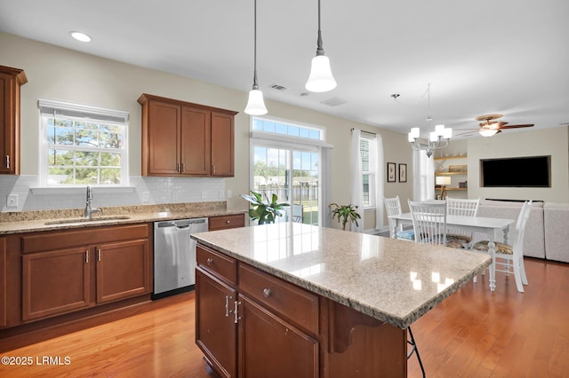 1216 Hearthstone Dr, Ridgeland, SC 29936 - kitchen with decorative backsplash, light wood-type flooring, a sink, and dishwasher
