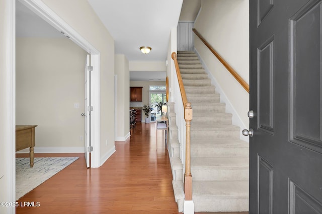 1216 Hearthstone Dr, Ridgeland, SC 29936 - foyer entrance featuring baseboards, stairs, and wood finished floors
