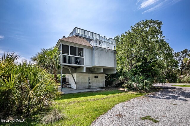 262 Deer Run Ln, Fripp Island, SC 29920 - back of house featuring a balcony and a yard