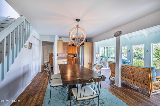 262 Deer Run Ln, Fripp Island, SC 29920 - dining space with a chandelier, stairs, dark wood-style floors, and beam ceiling