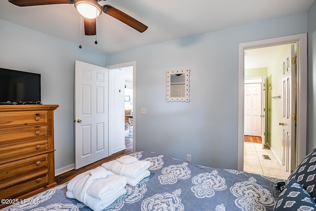 262 Deer Run Ln, Fripp Island, SC 29920 - bedroom featuring ceiling fan, baseboards, and connected bathroom