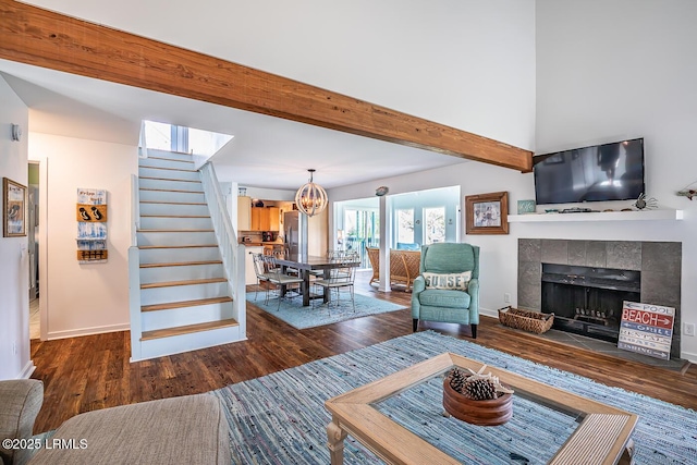 262 Deer Run Ln, Fripp Island, SC 29920 - living area featuring wood finished floors, baseboards, stairway, a chandelier, and beam ceiling
