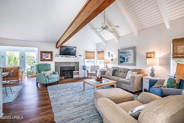 262 Deer Run Ln, Fripp Island, SC 29920 - living area with a ceiling fan, beamed ceiling, dark wood-style floors, a fireplace, and high vaulted ceiling