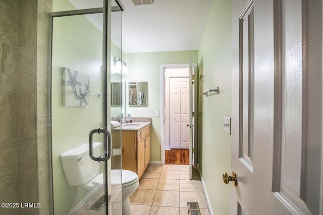 262 Deer Run Ln, Fripp Island, SC 29920 - bathroom featuring toilet, vanity, baseboards, and tile patterned floors