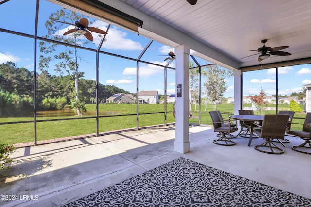 sunroom / solarium featuring ceiling fan