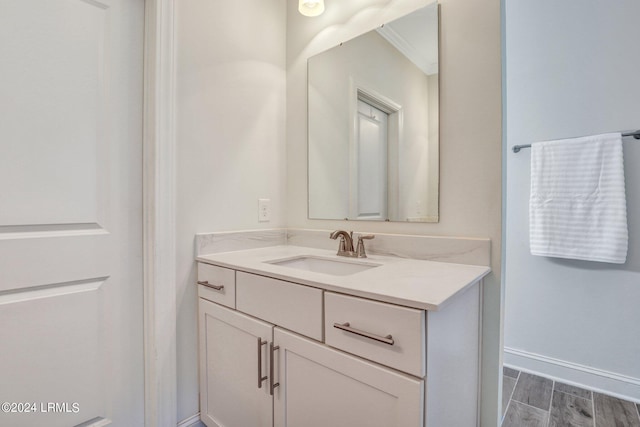 bathroom featuring vanity and ornamental molding