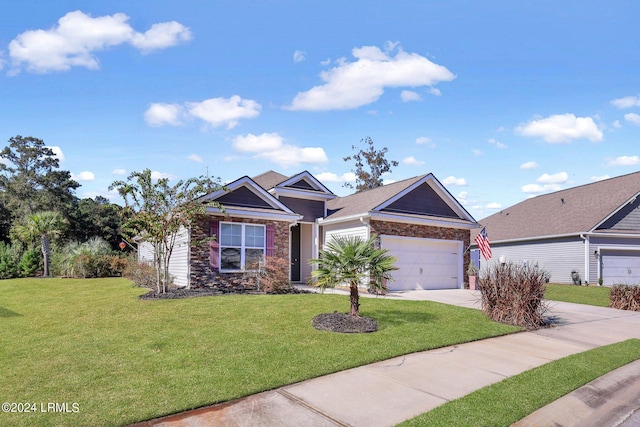 view of front of property featuring a garage and a front lawn