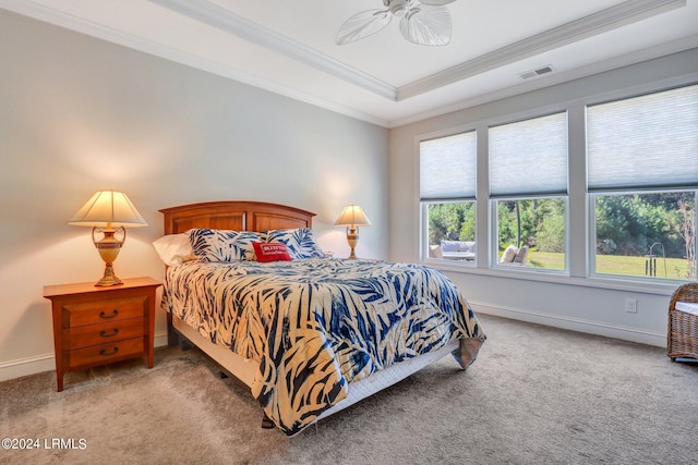 bedroom featuring crown molding, ceiling fan, a raised ceiling, and carpet floors