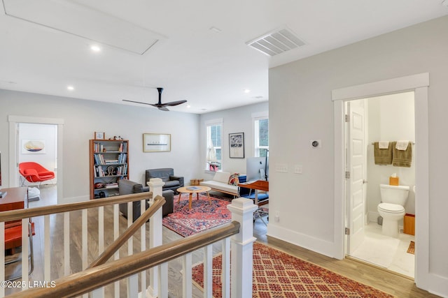 interior space featuring recessed lighting, visible vents, baseboards, and wood finished floors