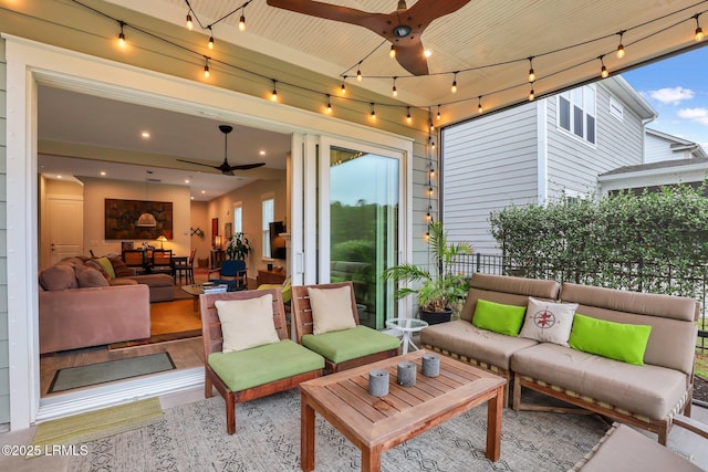 view of patio featuring ceiling fan, fence, and an outdoor hangout area