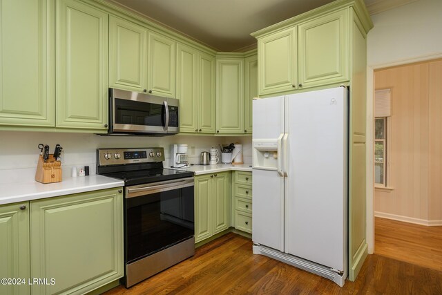 kitchen featuring stainless steel appliances and dark hardwood / wood-style floors