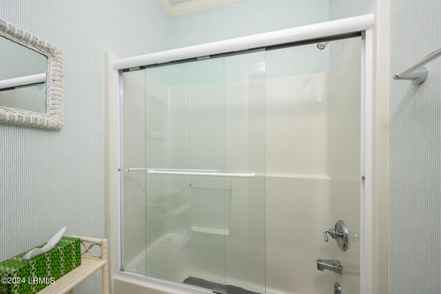 bathroom featuring shower / bath combination with glass door