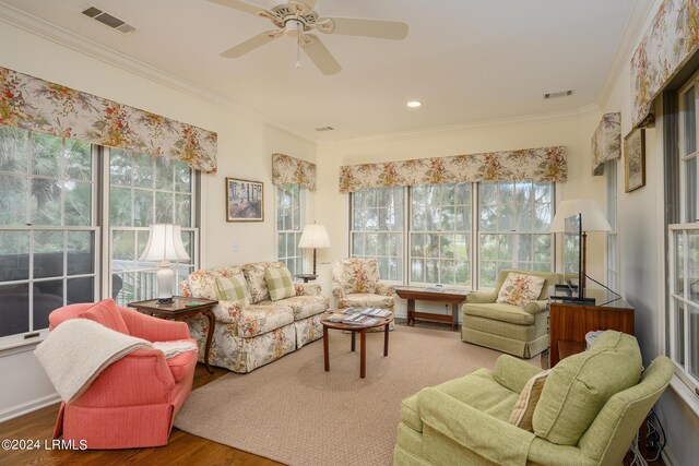 sunroom featuring plenty of natural light and ceiling fan