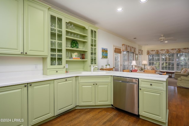 kitchen with crown molding, dishwasher, sink, and kitchen peninsula