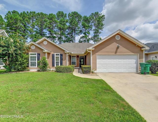 ranch-style house featuring a garage and a front lawn