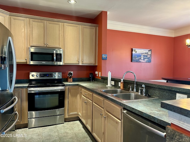 kitchen featuring light tile patterned floors, dark countertops, a sink, appliances with stainless steel finishes, and crown molding