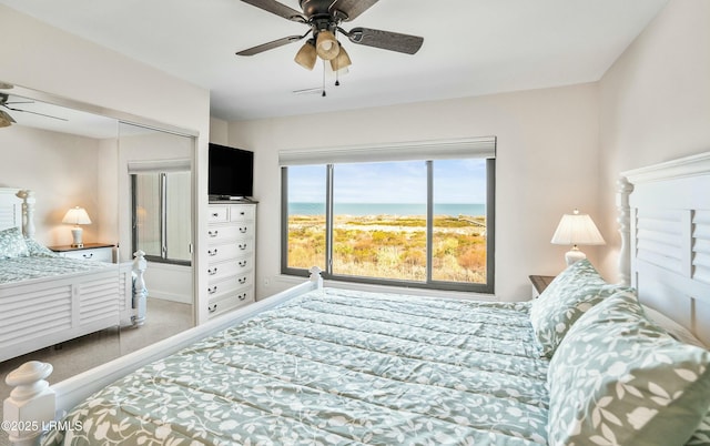 bedroom featuring ceiling fan and carpet flooring