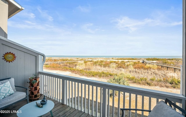 wooden terrace with a water view