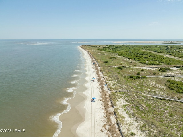 bird's eye view featuring a water view and a view of the beach