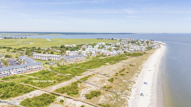 drone / aerial view with a water view and a view of the beach