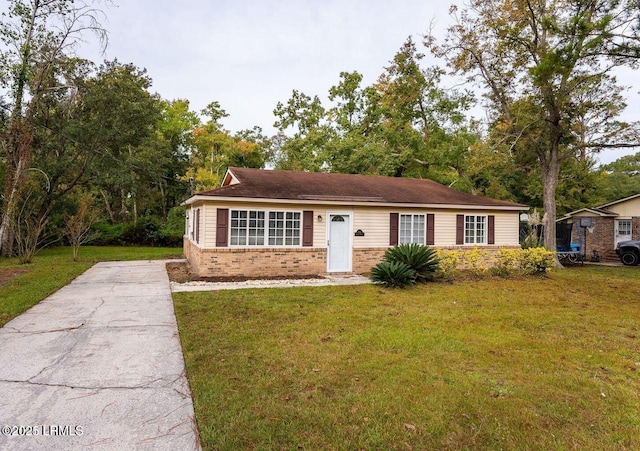 1717 Drayton Dr, Port Royal, SC 29935 - view of front of home featuring brick siding and a front lawn
