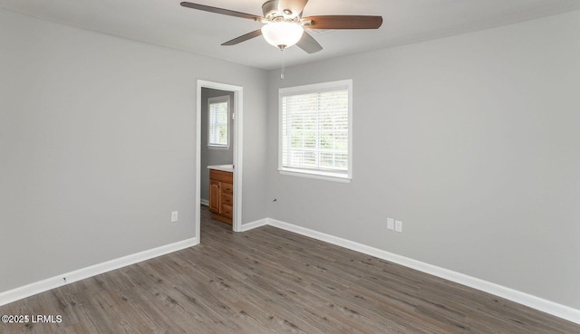 1717 Drayton Dr, Port Royal, SC 29935 - spare room with baseboards, ceiling fan, and dark wood-style floors