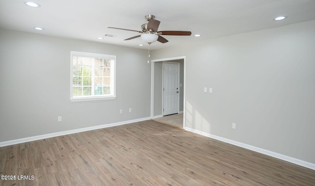 1717 Drayton Dr, Port Royal, SC 29935 - empty room featuring light wood finished floors, baseboards, visible vents, recessed lighting, and a ceiling fan