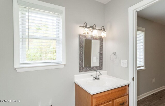 1717 Drayton Dr, Port Royal, SC 29935 - bathroom featuring baseboards, wood finished floors, and vanity
