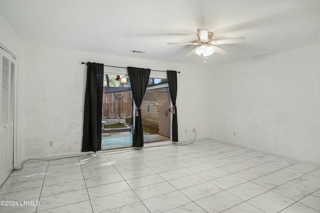 spare room featuring ceiling fan