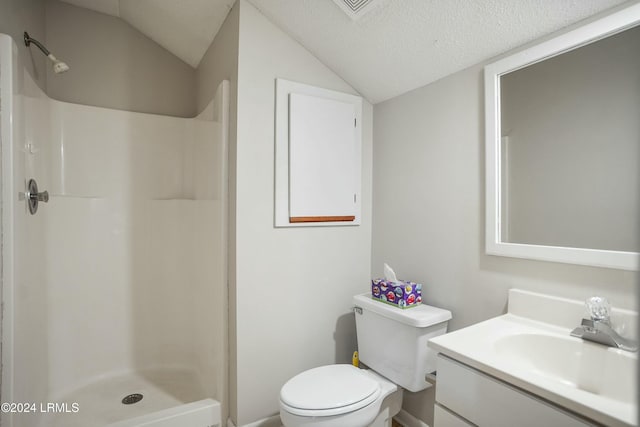 bathroom featuring walk in shower, lofted ceiling, toilet, a textured ceiling, and vanity