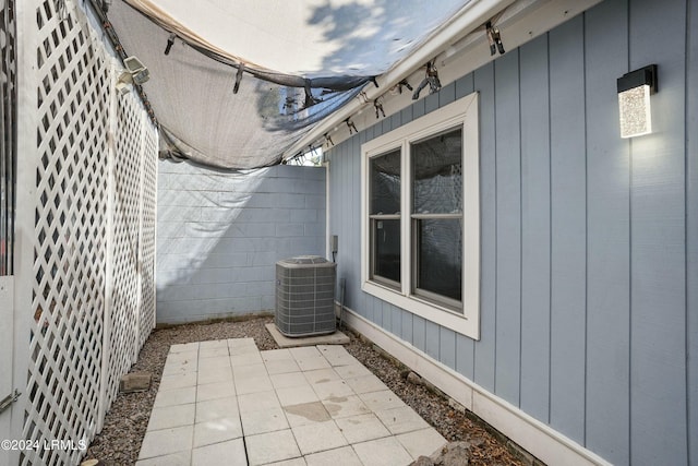 exterior space with central AC and a patio