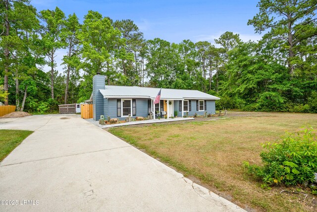 46 Mroz Rd, Beaufort, SC 29906 - view of front of property featuring driveway, covered porch, and a chimney