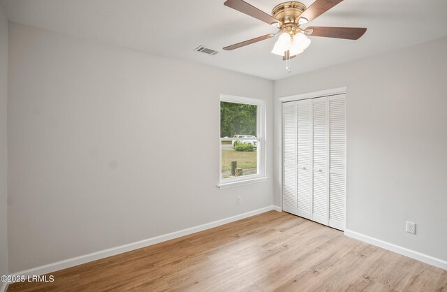 46 Mroz Rd, Beaufort, SC 29906 - unfurnished bedroom with a closet, light wood-style floors, baseboards, and ceiling fan